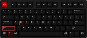 Eine Draufsicht auf eine QWERTY-Tastatur mit schwarzem Hintergrund. Die folgenden Tasten sind rot umrandet hervorgehoben: die Esc-Taste (ganz rot gefärbt), die S-Taste, die linke Umschalttaste (Shift) und die linke Windows-/Befehlstaste. Dieses Bild wird häufig verwendet, um die Windows Screenshot Tastenkombination Windows-Taste + Shift + S für das Snipping Tool (Ausschneiden und Skizzieren) zu veranschaulichen.